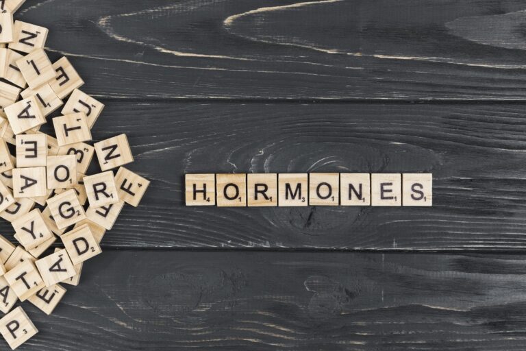 The word HORMONES spelt out using Scrabble tiles.